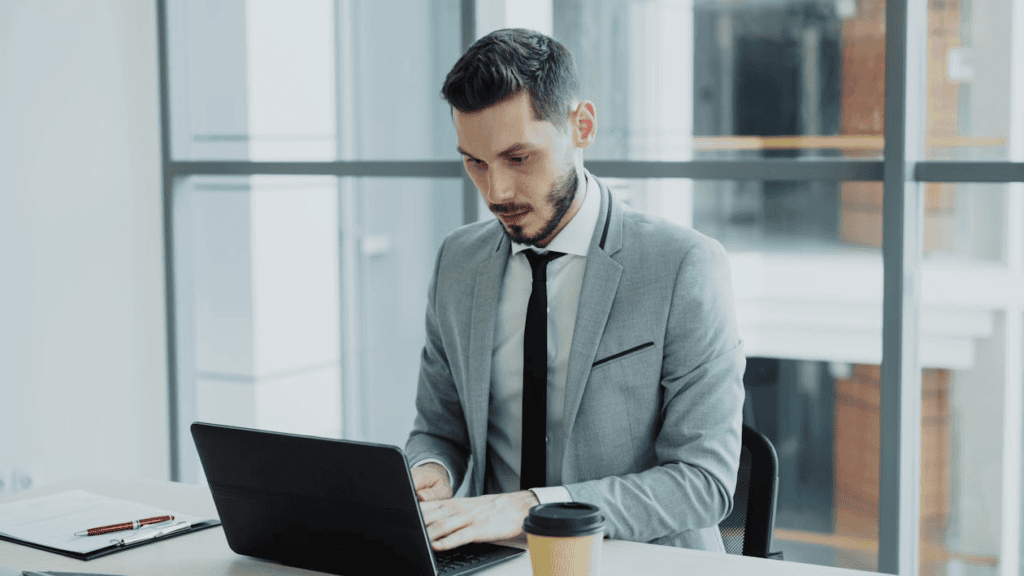 professional man working on laptop in office 